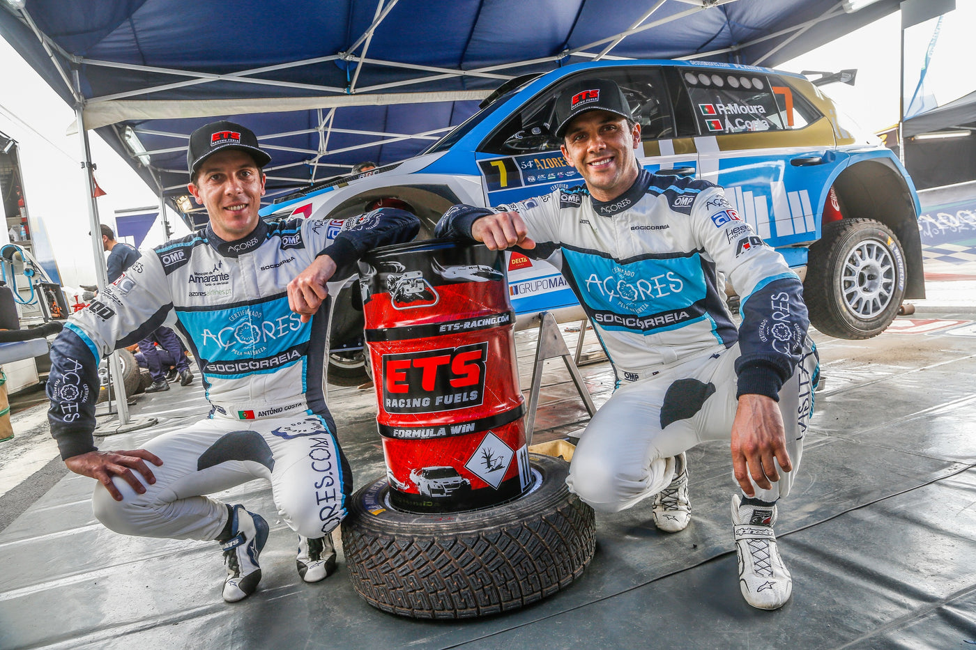 Ricardo Moura posing with his rally car and ETS Racing Fuel